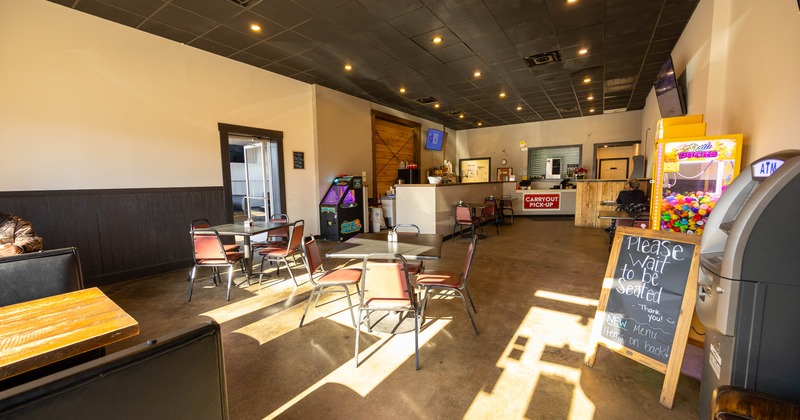 Interior, tables and chairs in dining area