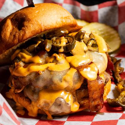 Double bacon cheeseburger with jalapenos.