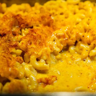 A close-up of baked macaroni and cheese.