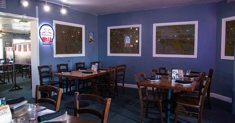 Interior, tables set for guests in dining area