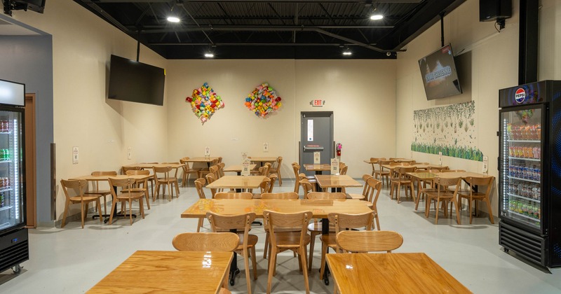 Interior, tables and chairs in dining area