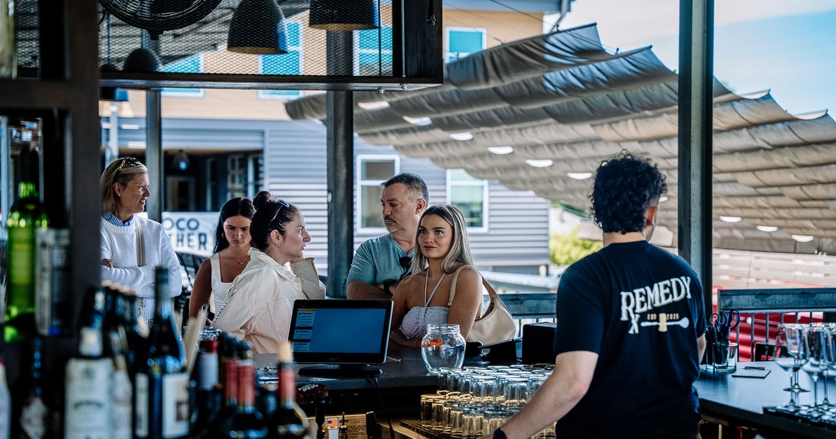Customers waiting in line at the bar