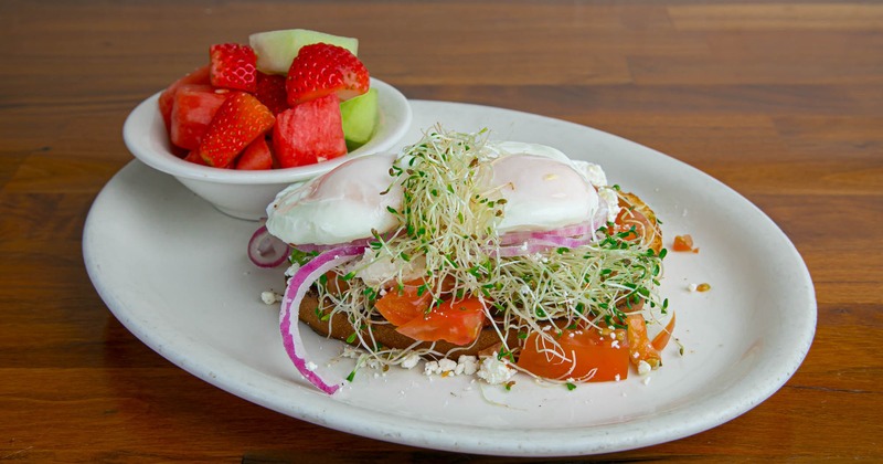 Avocado toast with a fruit salad