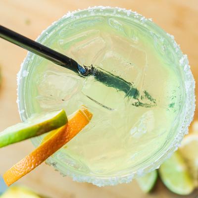 House Margarita with orange and lime garnish, top view