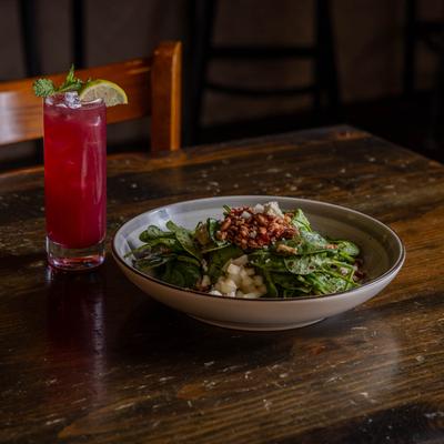Pear and pecan salad with a cocktail.