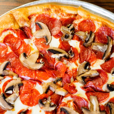 Pizza with pepperoni, cheese, and mushrooms.