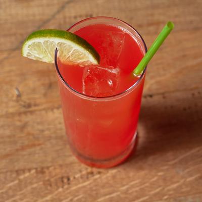 Blood orange margarita in glass, top view.