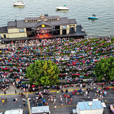 Aerial view of the river stage and crowds during a concert
