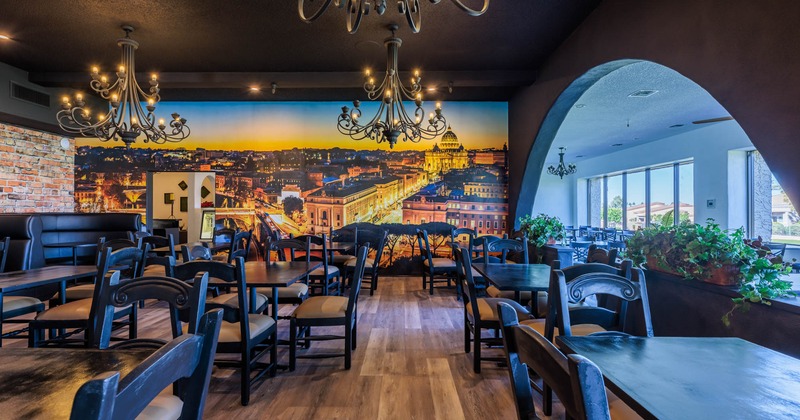 Interior, tables and chairs, decorated wall behind