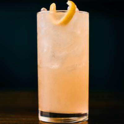 Citrus cocktail in a tall glass.