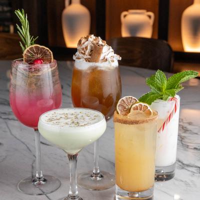 Different cocktails, side view.