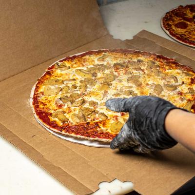 A freshly baked pizza with mushrooms.