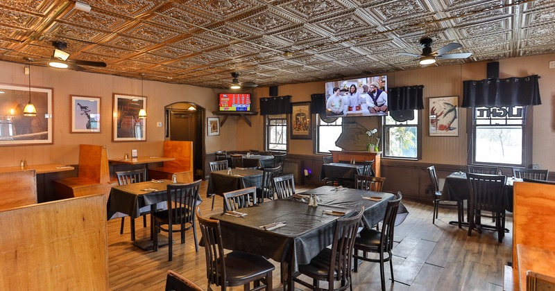 Interior, tables set for guests in dining area