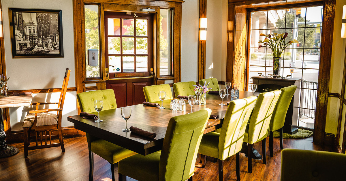 Interior, Parkview room, dining table for eight, entrance, large window on the right