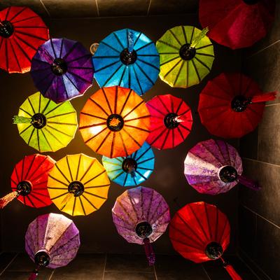 Low angle view of multi colored hanging lanterns on the ceiling inside