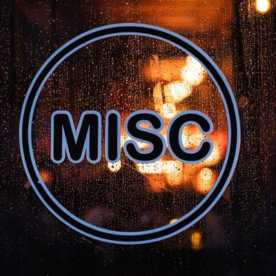 MISC logo window decal on a rain-speckled glass.