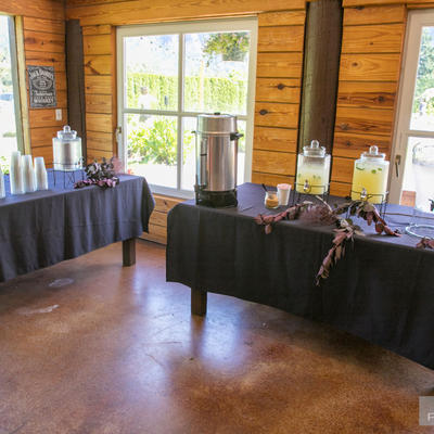 Refreshments on two tables,water, lemonade,coffee