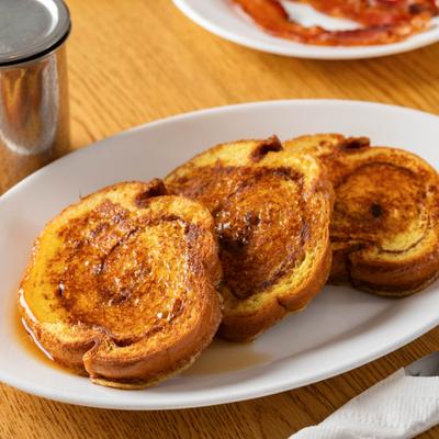 Cinnamon Swirl French Toast topped with syrup.