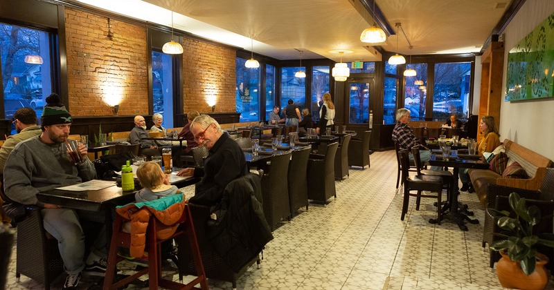 Interior, dining area, guests chatting enjoying their food and drinks