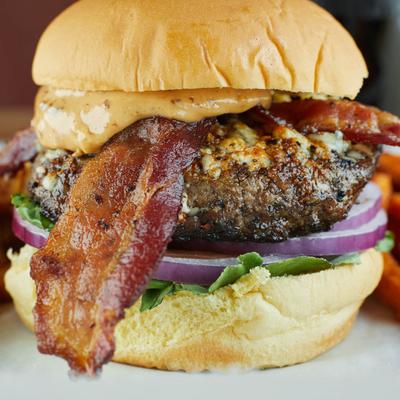 Nawlins Burgher, with Cajun spices, chipotle mayo, bacon, blue cheese, lettuce, tomato and onion.