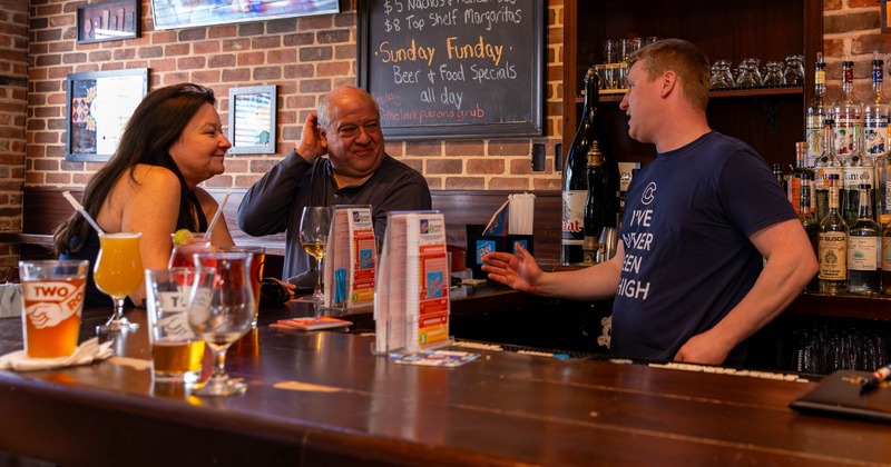 Bartender serving customers