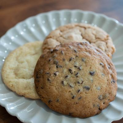 A plate with three cookies on it.