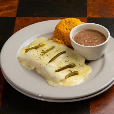 Arturo's Sour Cream Enchiladas served with rice and beans.