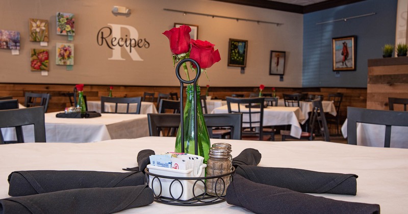 Interior detail, flowers in a vase placed on a table