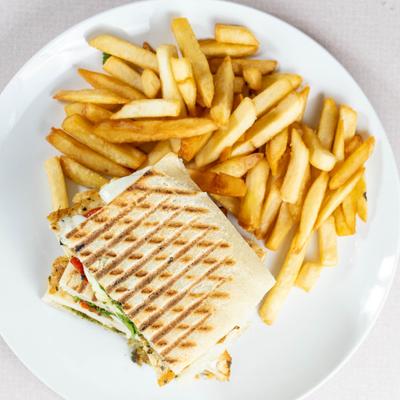 Roman special panini with a side of fries, top view.