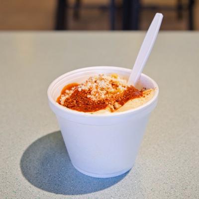 Mexican street corn salad served in a cup.