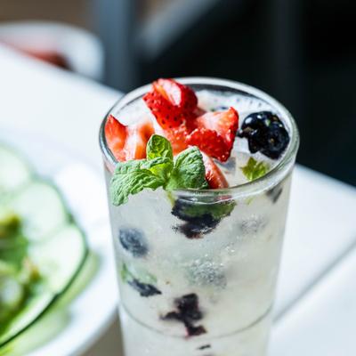Berry Mojito cockktail, served on the table.