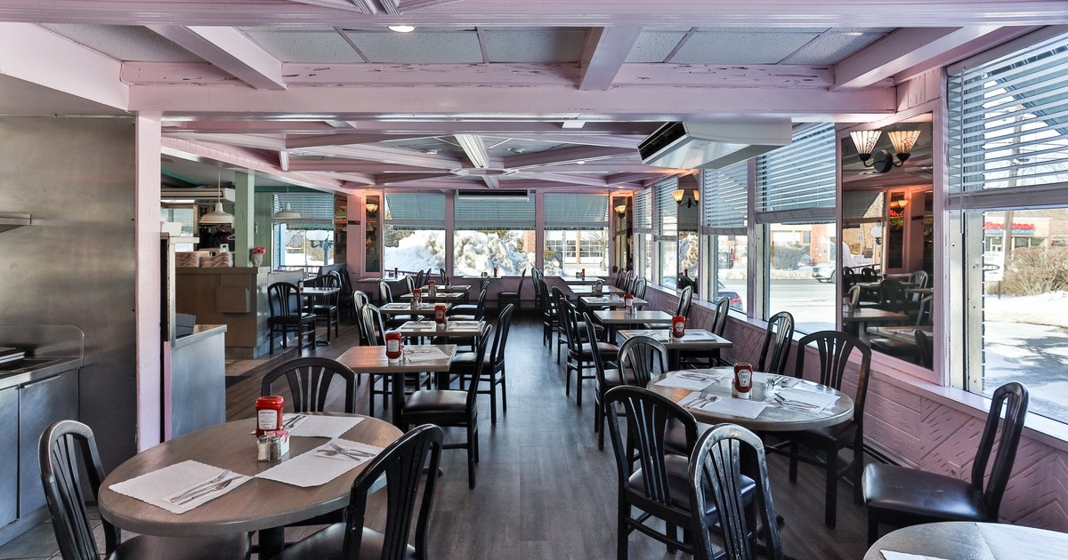 Interior, dining booths and tables by the windows