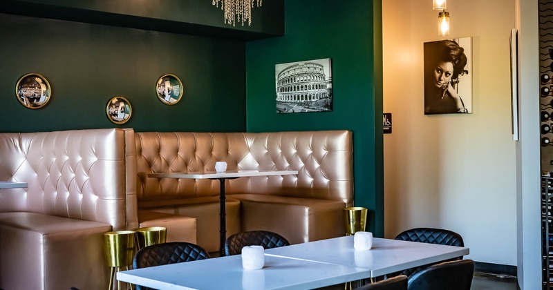 Interior, dining booth with pictures on the wall above