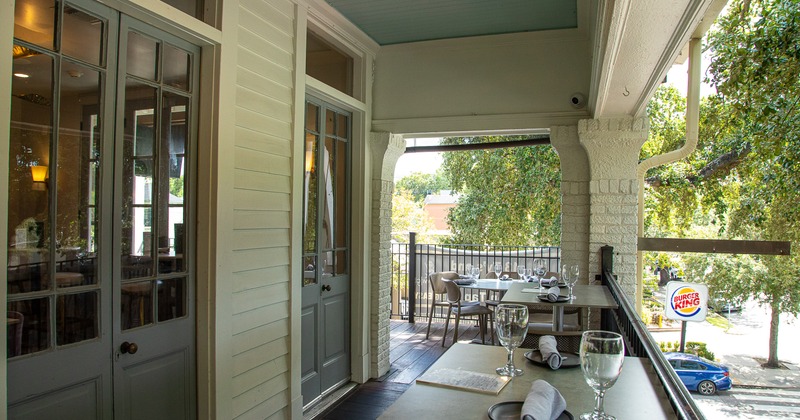 Covered patio with set dining tables