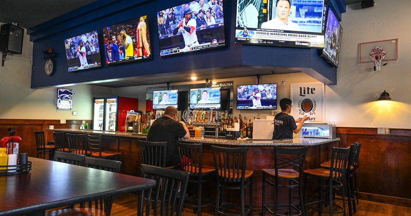 Bar area, TVs on the wall above