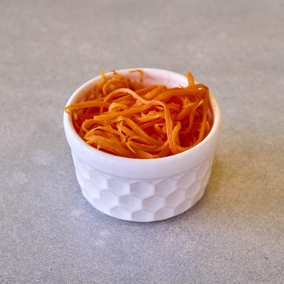 A side of Grated carrots.