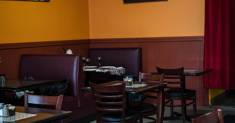 Interior, tables and chairs in dining area