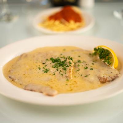 Vitello  piccata with lemon and creamy sauce.