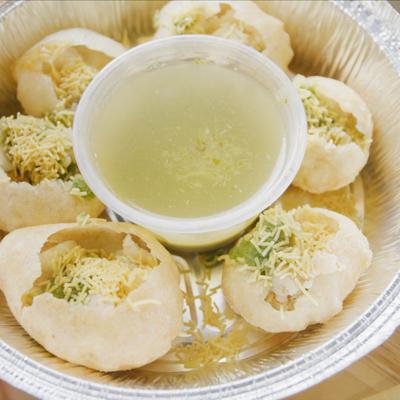 Decorated pastry with rice, dip in the middle