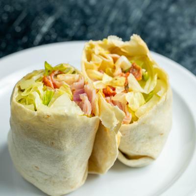 Chipped Italian Wrap, sliced in half and served.