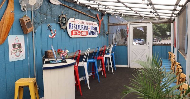 Bar table and chairs by the wall
