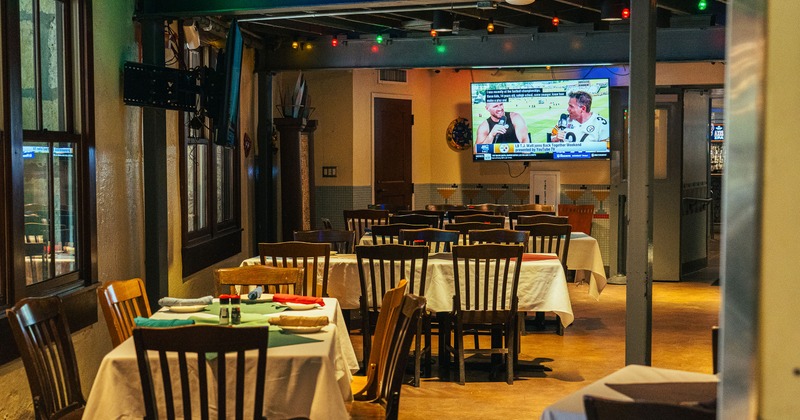 Cozy interior dining area with dining tables set for guests