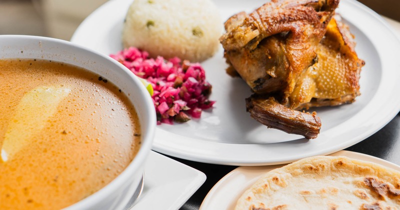 Roasted chicken meal with hen soup, tortillas, rice, and slaw