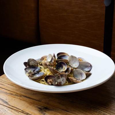 Linguine with clams served on the table.