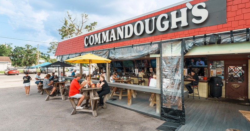 Outdoor seating area full of guests enjoying their food