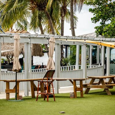 Outdoor seating area, picnic tables.