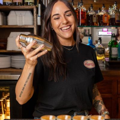 A bartender shaking a drink.