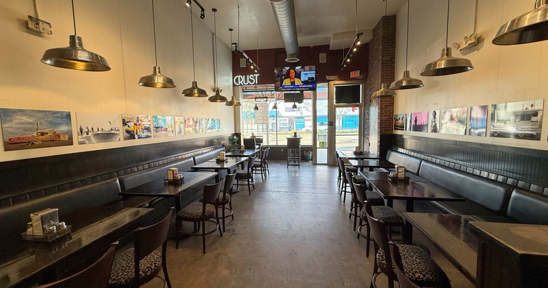 Interior, seating space with black leather benches and tables
