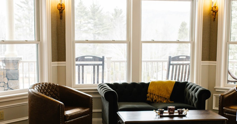 Interior, leather couches lounge by the window