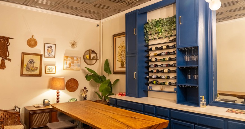 Modern interior with wooden floors, bar stools and large windows